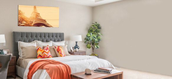 Large wooden print above bed in bedroom